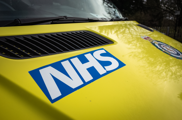 Image of NHS logo on front of vehicle