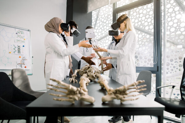 Group of science students analysing a skeleton