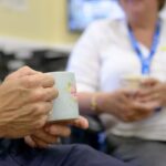 Two NHS staff chat over a cuppa